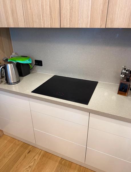 A new induction cooktop set into a stone benchtop