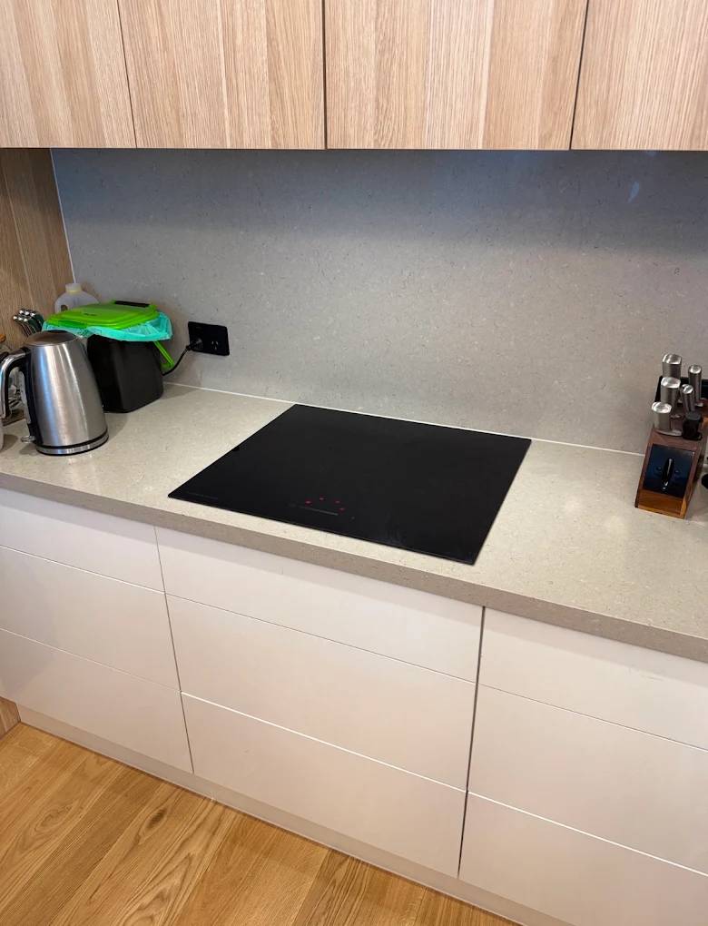 A new induction cooktop set into a stone benchtop
