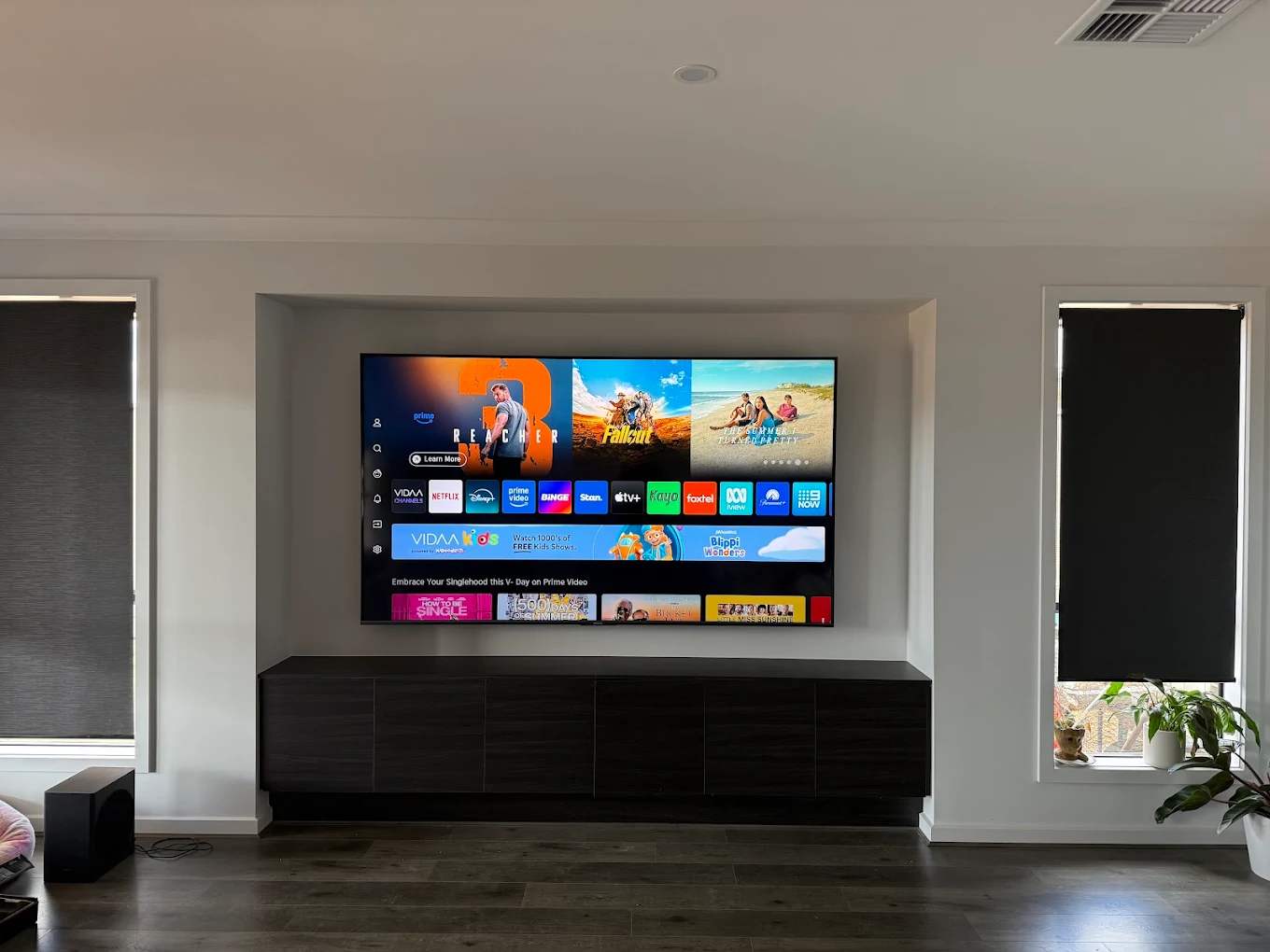 A wall-mounted TV with the cables hidden in the wall
