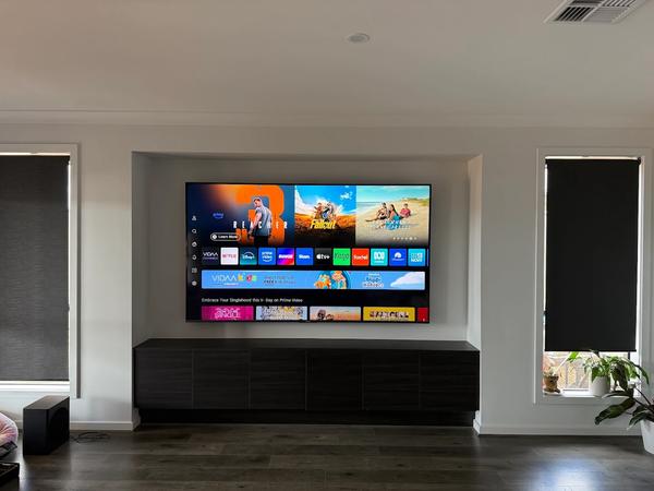 A wall-mounted TV with the cables hidden in the wall